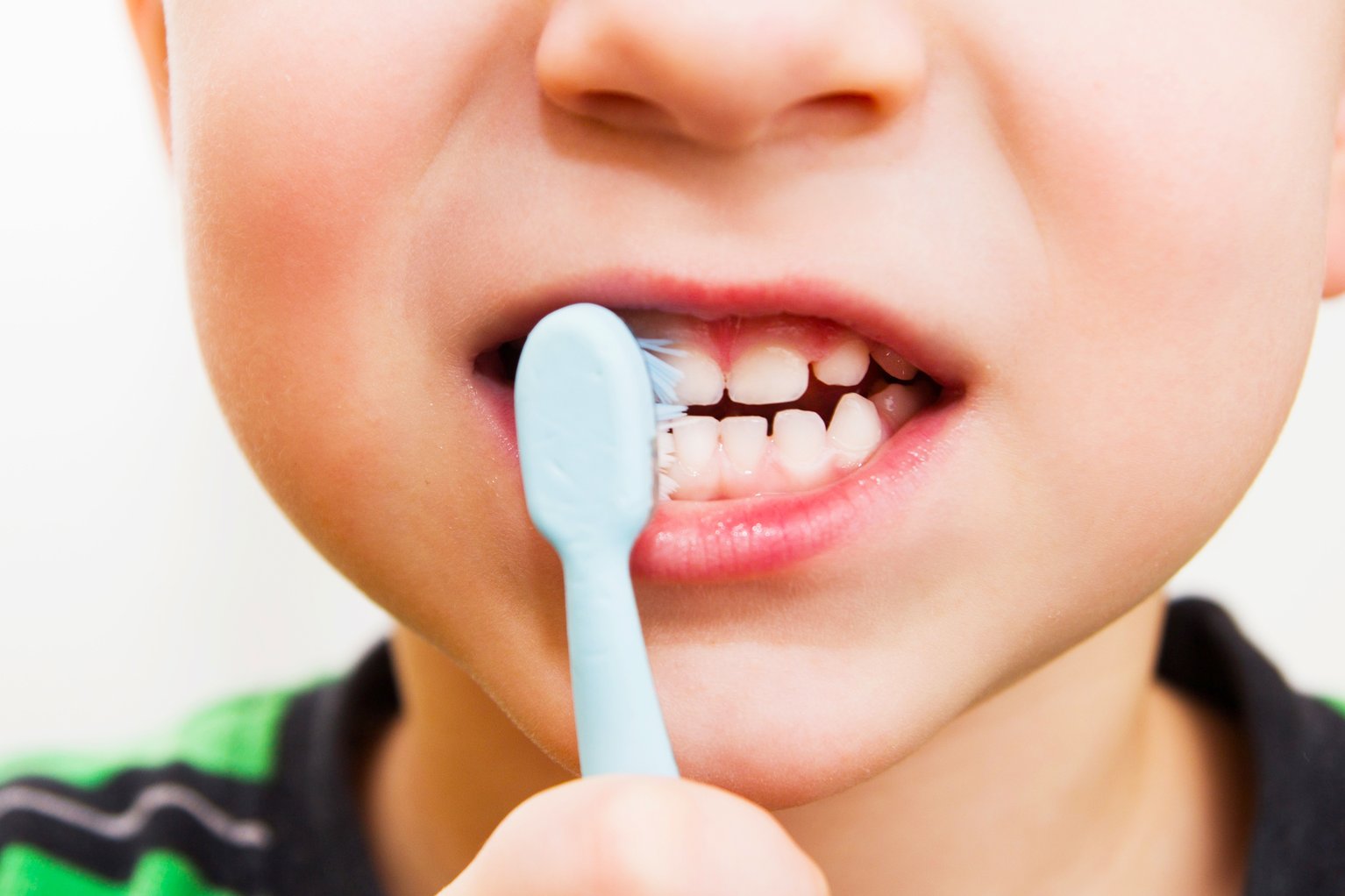 A boy brushing his teeth